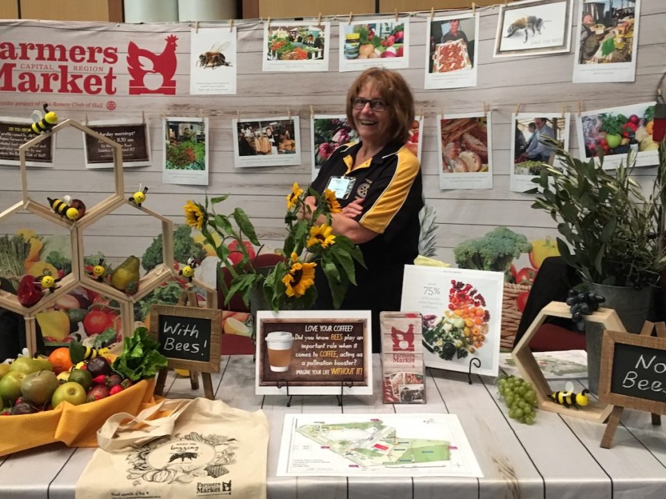 Yvonne from the Capital Region Farmers Market at the 'World Bee Day' display at Australian Parliament House along with a number of Embassies, ACT for Bees and the Capital Region Beekeepers.